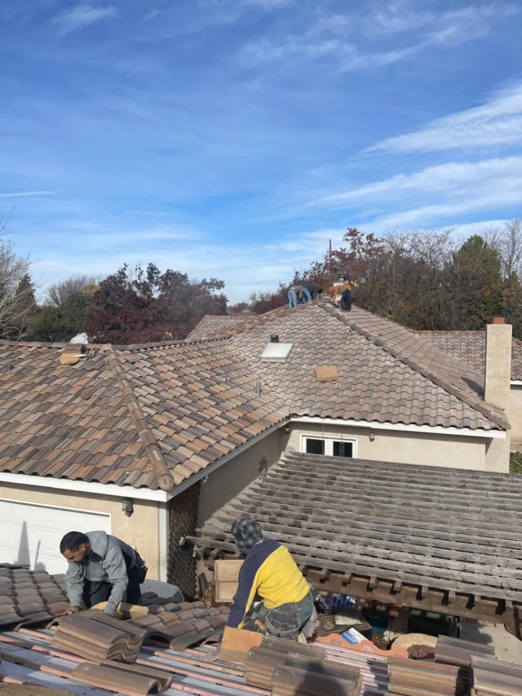Sal Morales Roofing crew installing tile roofing